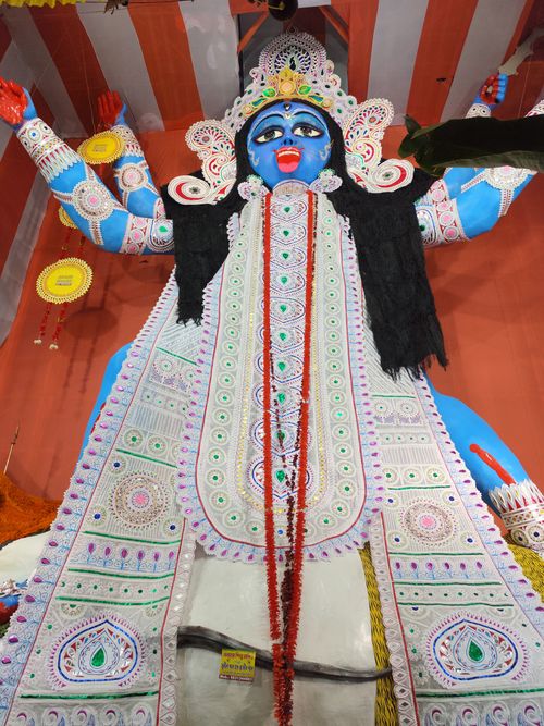 Free Colorful depiction of Goddess Kali in a traditional Indian temple setting. Stock Photo