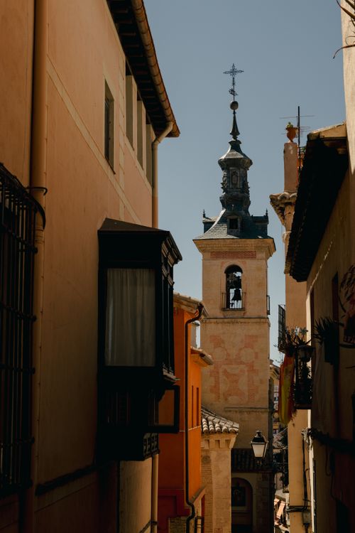 Free Scenic street view of a historic bell tower in Toledo, Castilla-La Mancha, Spain during daytime. Stock Photo