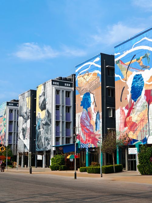 Free Colorful murals adorn buildings in Chennai, India, showcasing creative urban street art. Stock Photo