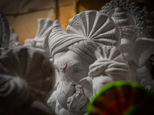 Free Close-up of traditional Ganesha statues with detailed turbans, highlighting cultural artistry and craftsmanship. Stock Photo