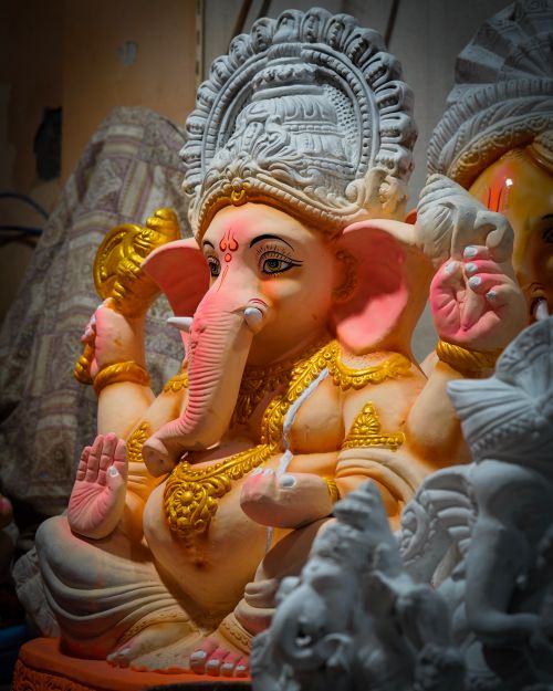 Free Vibrant Ganesha statue in a workshop, symbolizing art and spirituality. Stock Photo