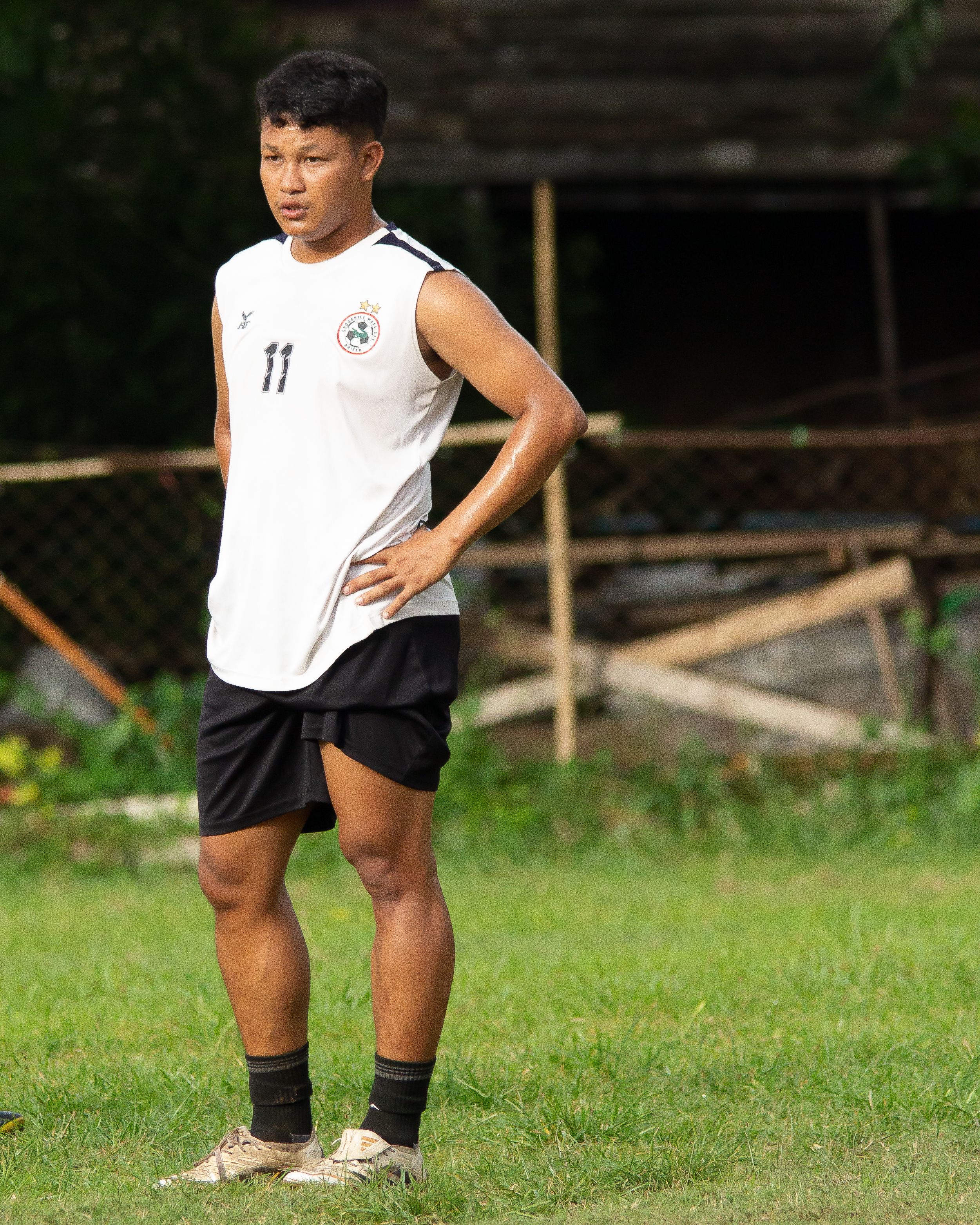Young male football player in Myawadi during practice on a sunny day.