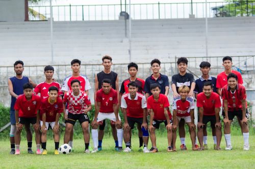 Free A group of young men posing as a football team in Myawadi, Myanmar. Stock Photo