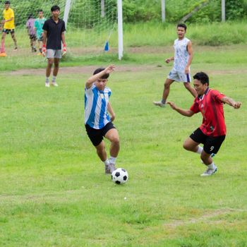 Exciting soccer game with players in Myawadi, Myanmar showcasing teamwork and skill on the field.（イメージ）