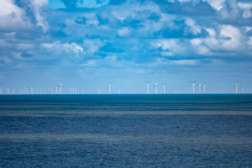 Free Scenic view of wind turbines on the sea off Llandudno, Wales. Stock Photo