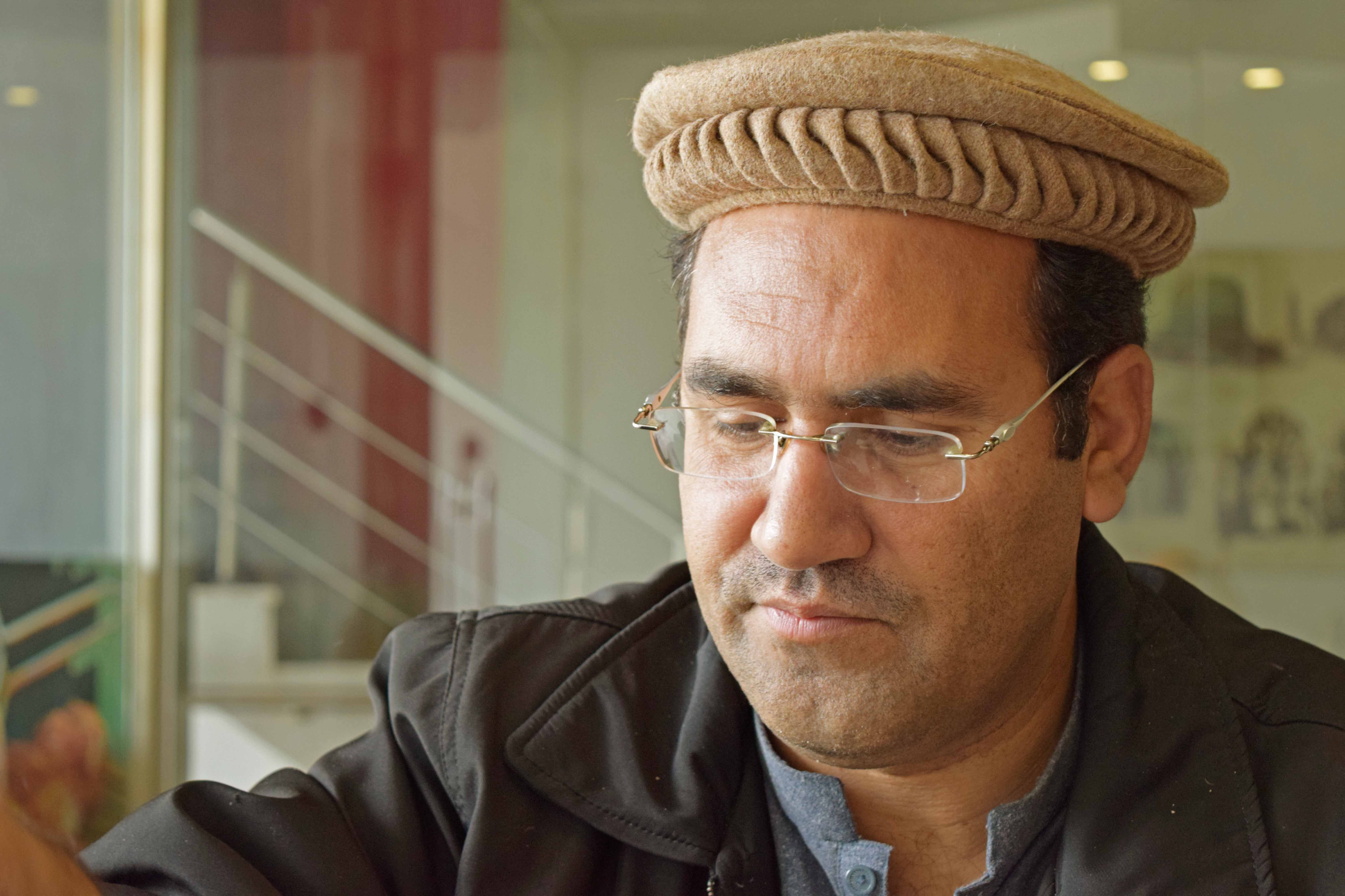 Man wearing a traditional pakool hat reflecting Pashtun culture in Khyber Pakhtunkhwa, Pakistan.