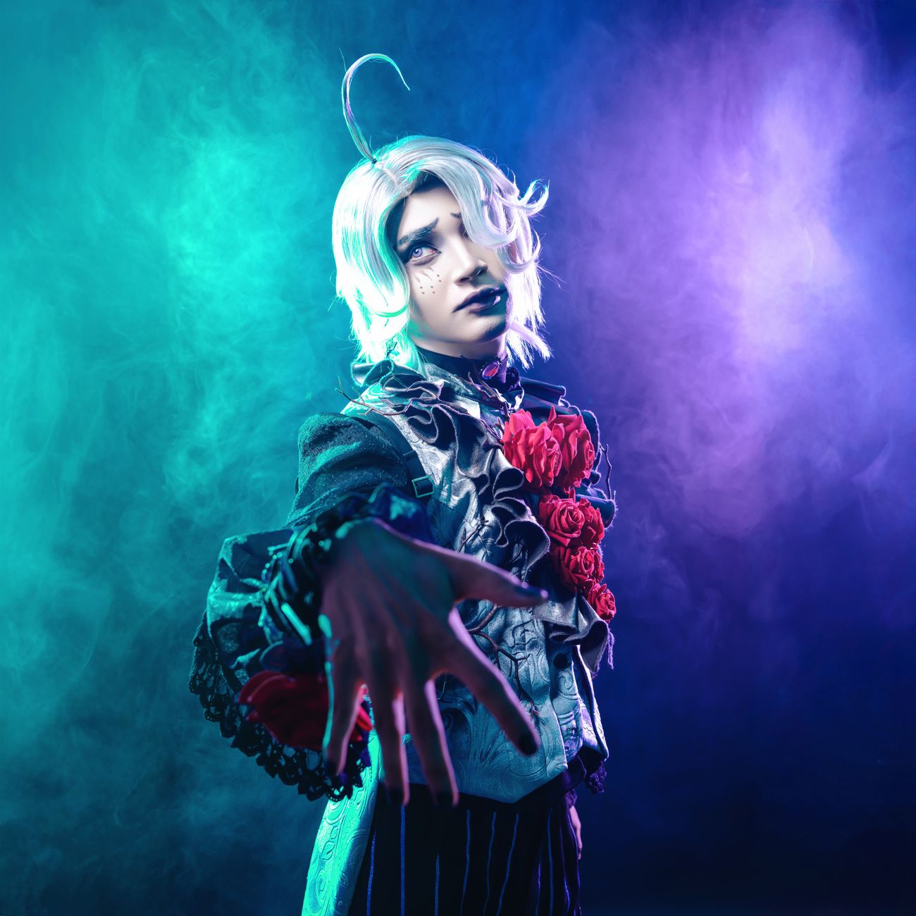 A striking portrait of a cosplayer with vivid colored lighting and intricate costume details.