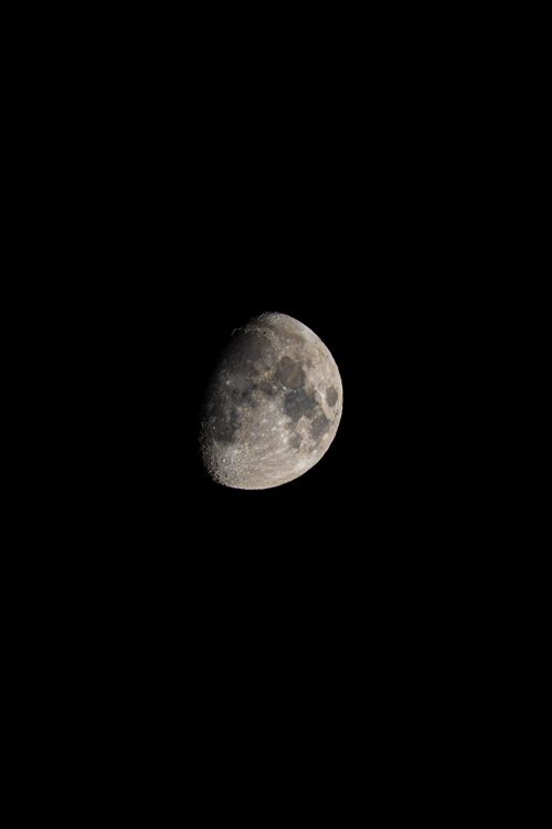 Free Close-up shot of the waxing gibbous moon under a clear night sky. Stock Photo