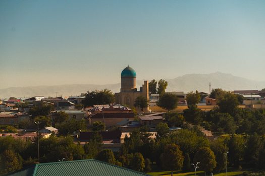 A panoramic view of Samarkand's cityscape with historic architecture and greenery.
