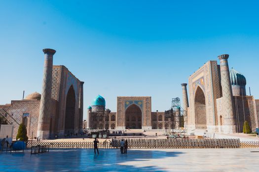 Explore the stunning architecture of Registan Square in Samarkand, Uzbekistan at daytime.