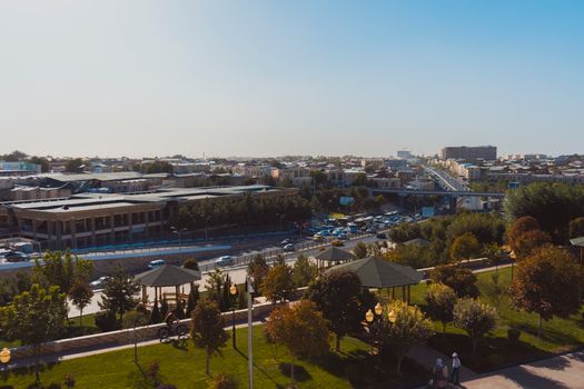 Explore the vibrant autumn cityscape of Samarkand, Uzbekistan with a blend of modern and traditional architecture.