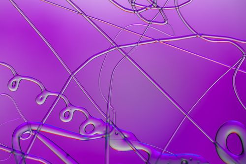 Free Vivid abstract art featuring dynamic lines and fluid shapes on a purple background. Stock Photo