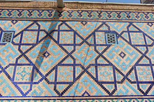 Free Explore stunning mosaic tile patterns on historic walls in Samarkand, Uzbekistan. Stock Photo