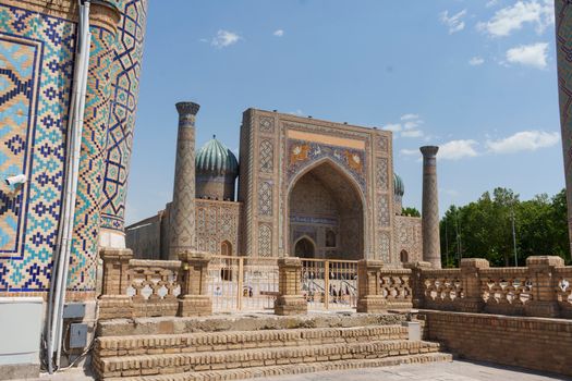 Explore the stunning architecture of Registan Square in Samarkand, Uzbekistan, under a clear blue sky.