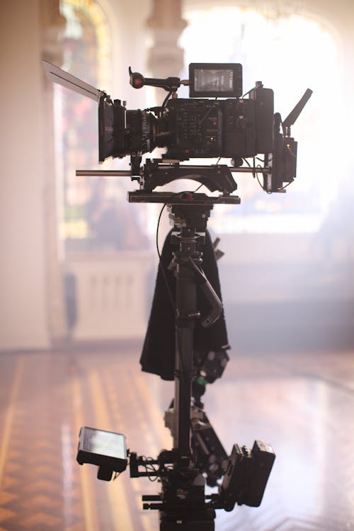 Black Video Camera On Tripod