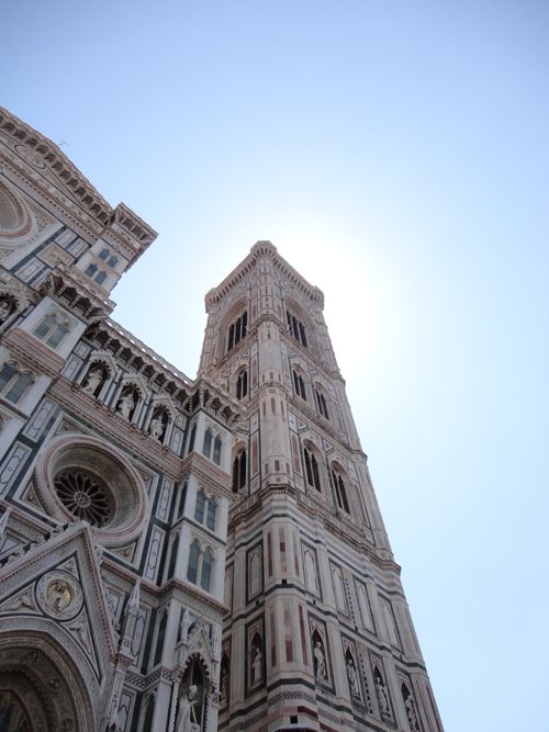 Free Upward view of the Florence Cathedral bell tower with a clear sky backdrop, showcasing Gothic architecture. Stock Photo