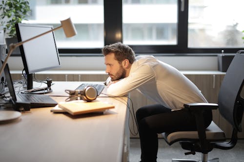 Free Man in White Shirt Sitting on Chair Stock Photo