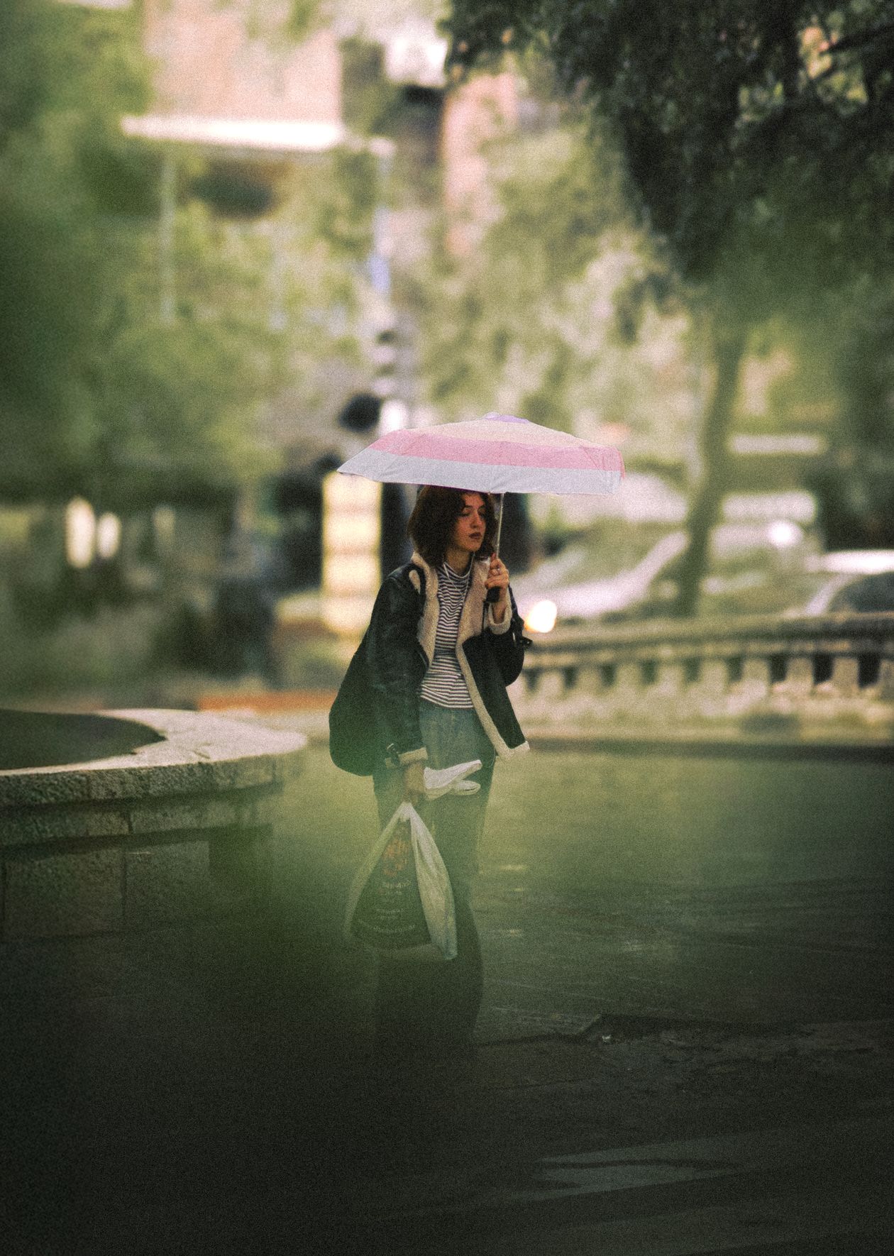 Person with an umbrella on a rainy street