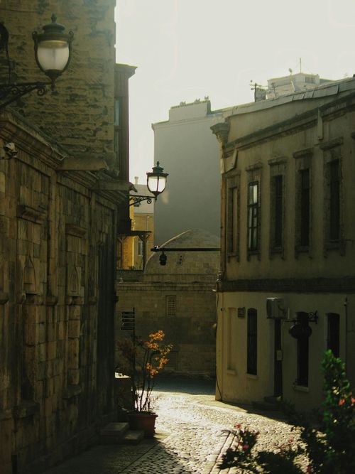 Free A peaceful morning scene of a cobblestone street in Baku's old town with historic architecture. Stock Photo