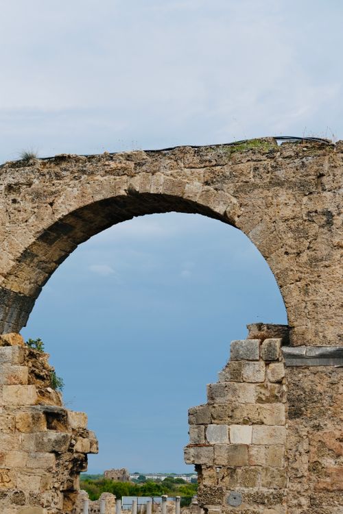 Free Historic stone archway amidst ancient ruins in Turkey, showcasing architectural heritage. Stock Photo