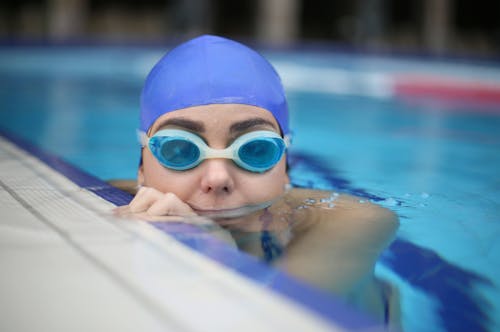 Person Wearing Blue Swimming Goggles