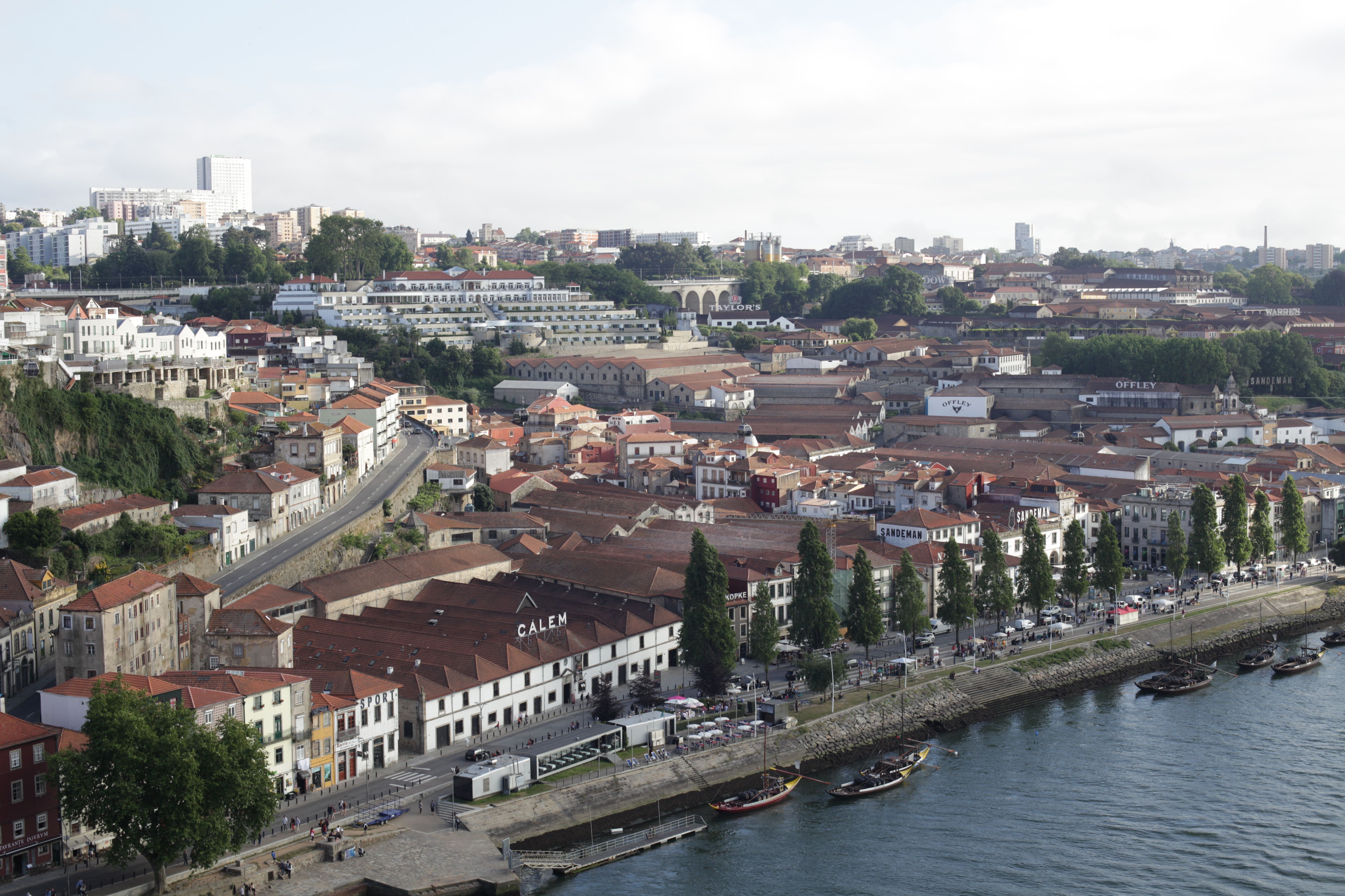 Aerial view of Vila Nova de Gaia's traditional architecture and riverside.