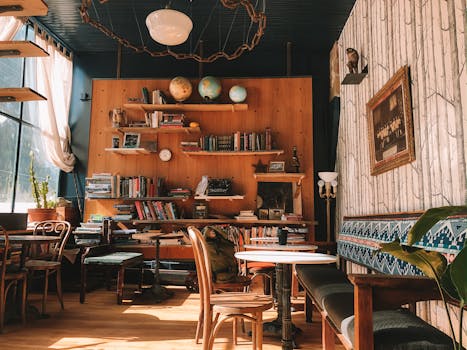 A charming cafe setting in Silver Plume featuring books, globes, and vintage decor. Ideal for cozy reading sessions.