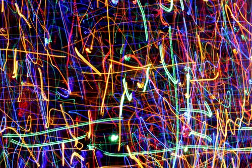 Free Vibrant abstract image featuring colorful light trails in dramatic motion. Stock Photo