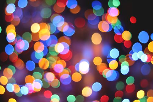 Free Defocused colorful bokeh lights creating a vibrant abstract background. Stock Photo