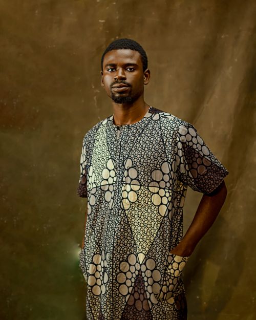 Free Portrait of a man wearing traditional African attire with a patterned design. Stock Photo