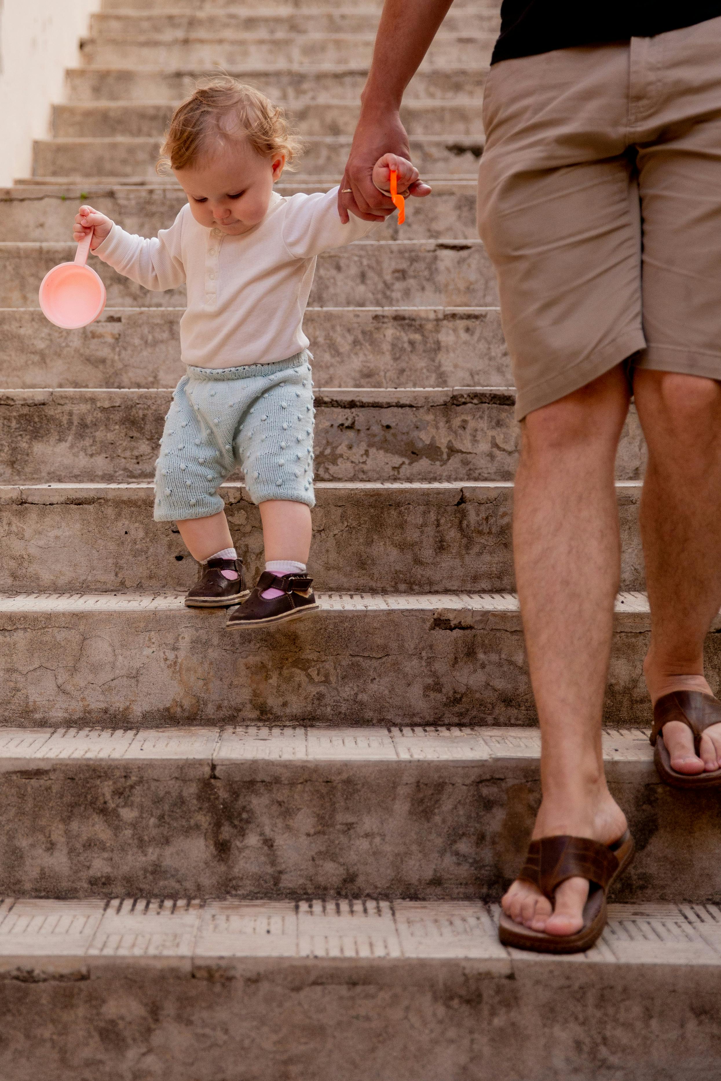 little kid going down the stairs