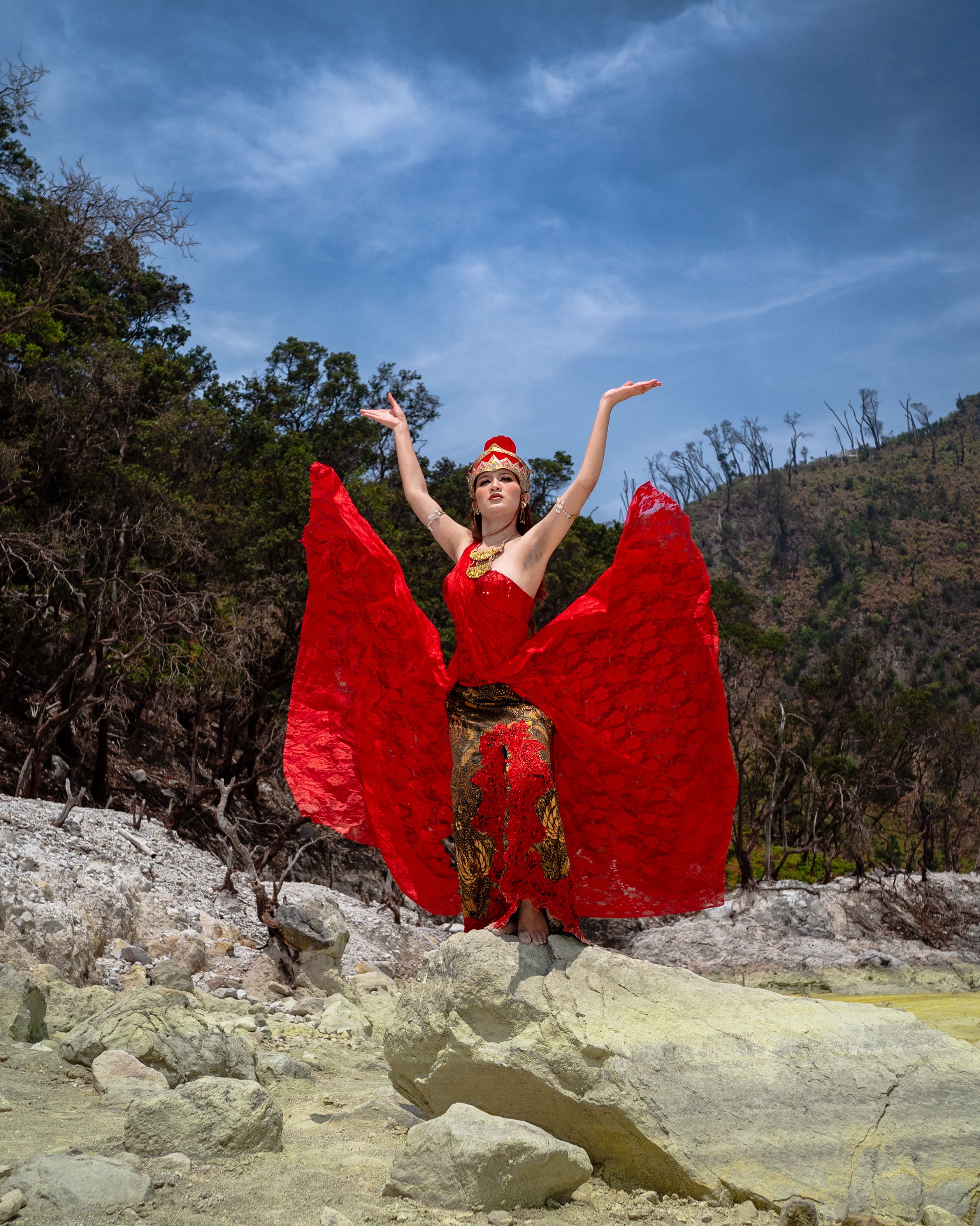 Woman in Vibrant Red Dress Posing Outdoors · Free Stock Photo