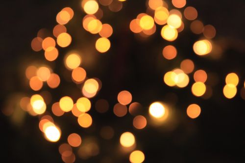 Free Abstract bokeh of warm, glowing lights creating a festive atmosphere. Stock Photo