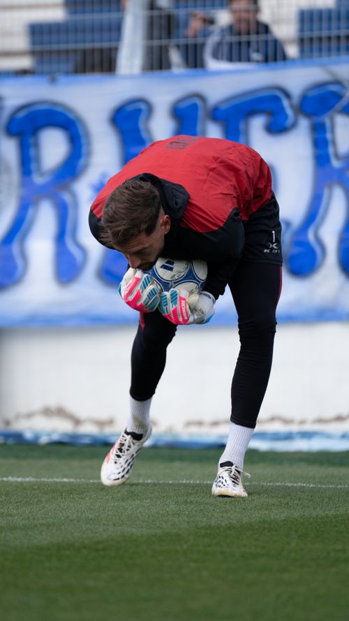 Free Goalkeeper training session, practicing ball control on the field. Stock Photo
