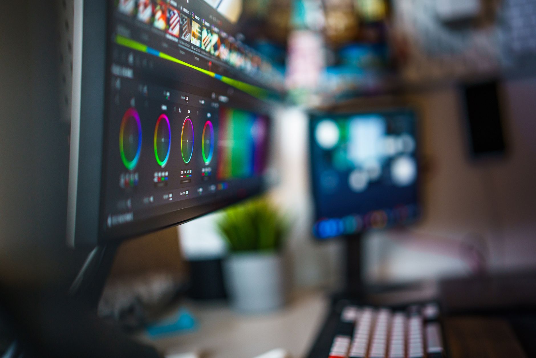 faceless video editing setup with dual monitors