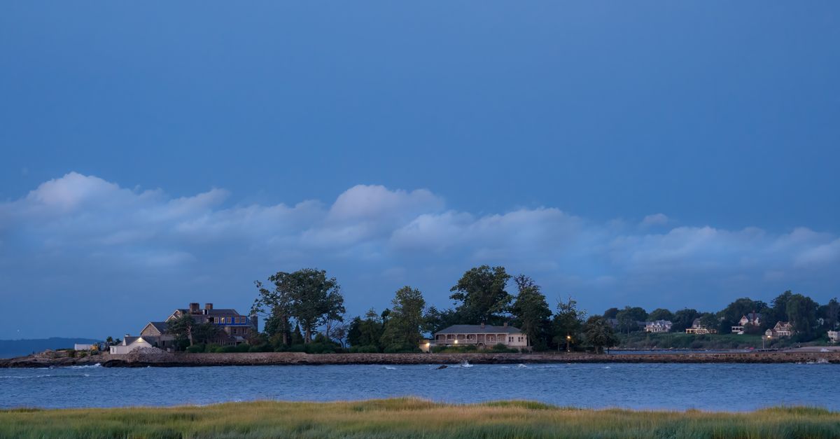 Serene twilight view of Cove Island Park in Stamford, Connecticut, with a clear sky and calm waters.