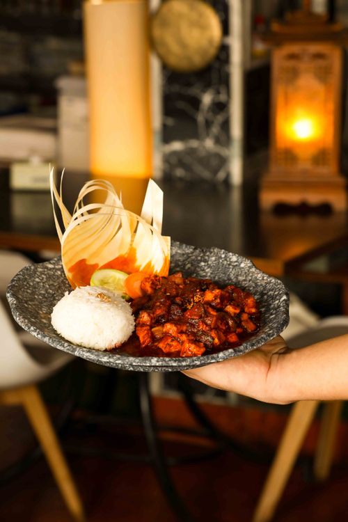 Free Gourmet dish with rice and vegetable garnish served indoors, highlighting elegant presentation. Stock Photo