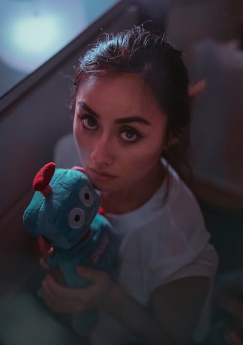 Girl In White Crew Neck T-shirt Holding Blue Plush Toy