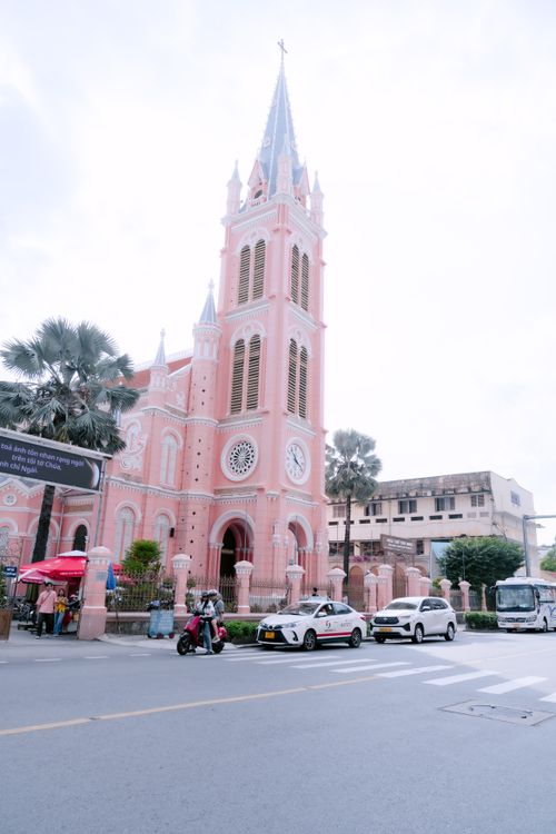 Free Daytime view of the famous pink Gothic-style cathedral with people in an urban setting. Stock Photo