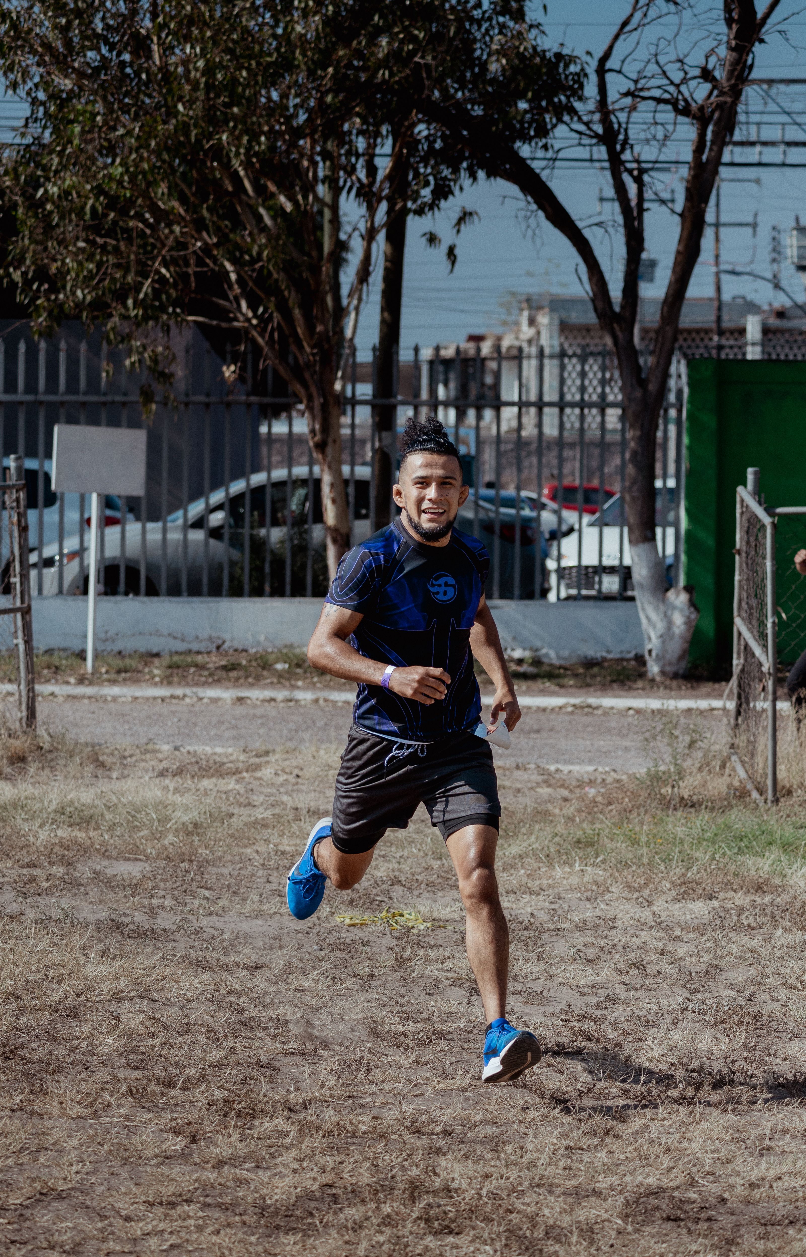 Energetic adult male running outdoors, showcasing athleticism and fitness in San Luis Potosí, Mexico.