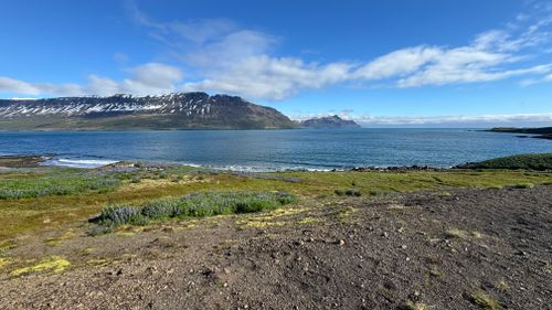 Free Explore the breathtaking beauty of Seyðisfjörður's fjord, showcasing serene waters and snow-capped mountains. Stock Photo