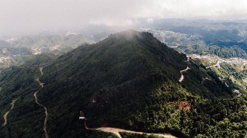 Free Scenic aerial view of a lush, green mountain landscape in Chiapas, Mexico, covered with clouds. Stock Photo