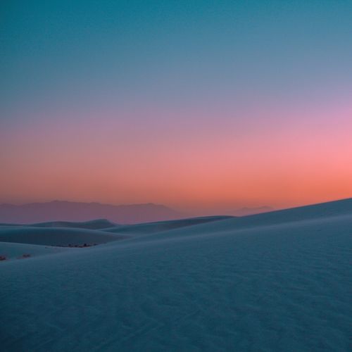 Free Vibrant sunset over the vast dunes of White Sands, New Mexico. Stock Photo