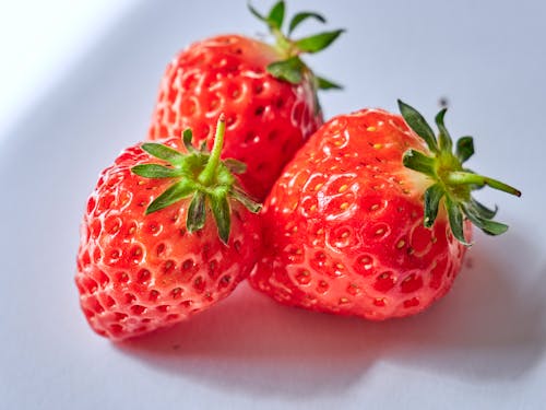 Red Strawberries On White Ceramic Plate