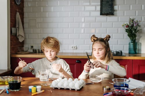 Siblings Doing DIY Easter Eggs