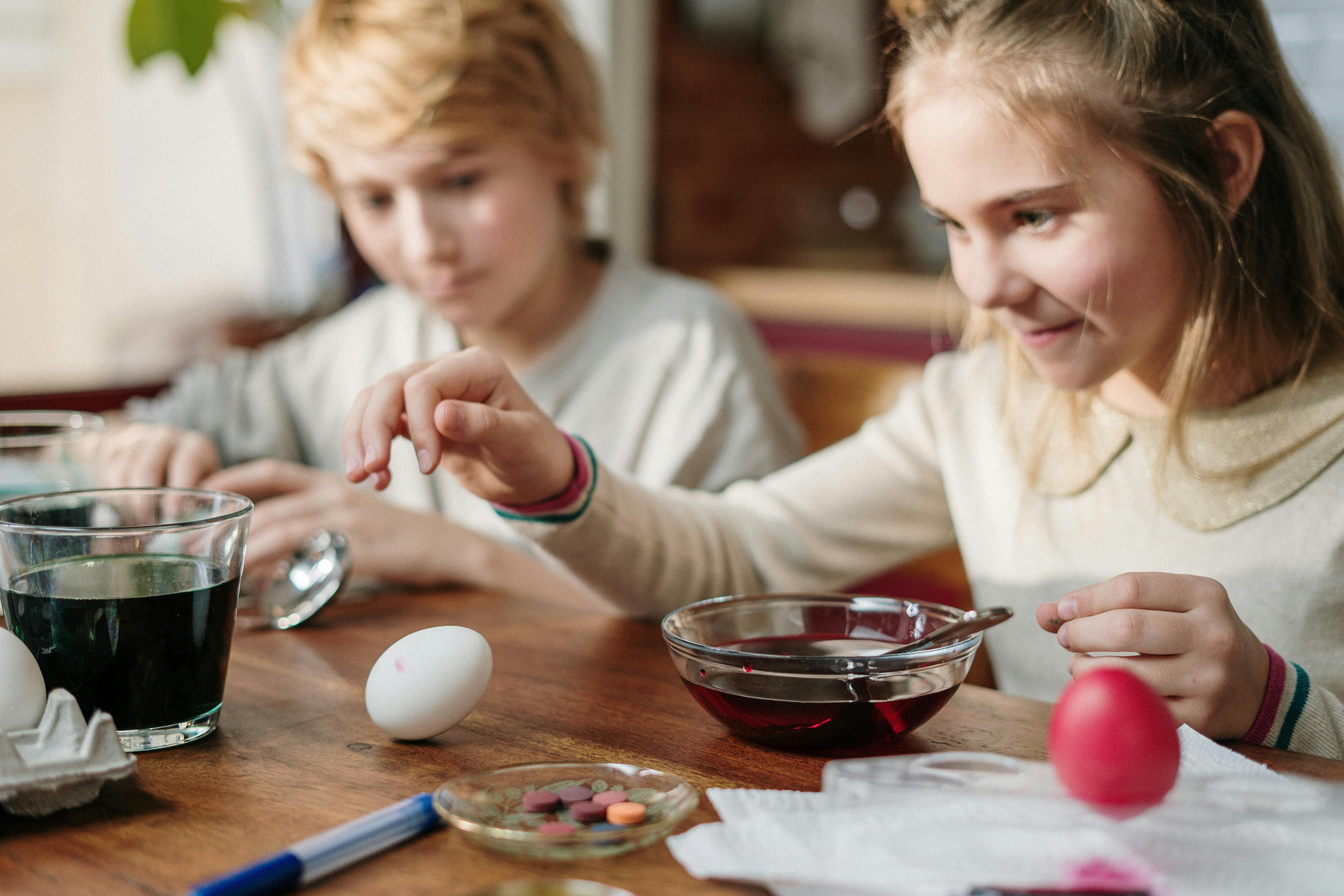 kids having fun making diy easter eggs