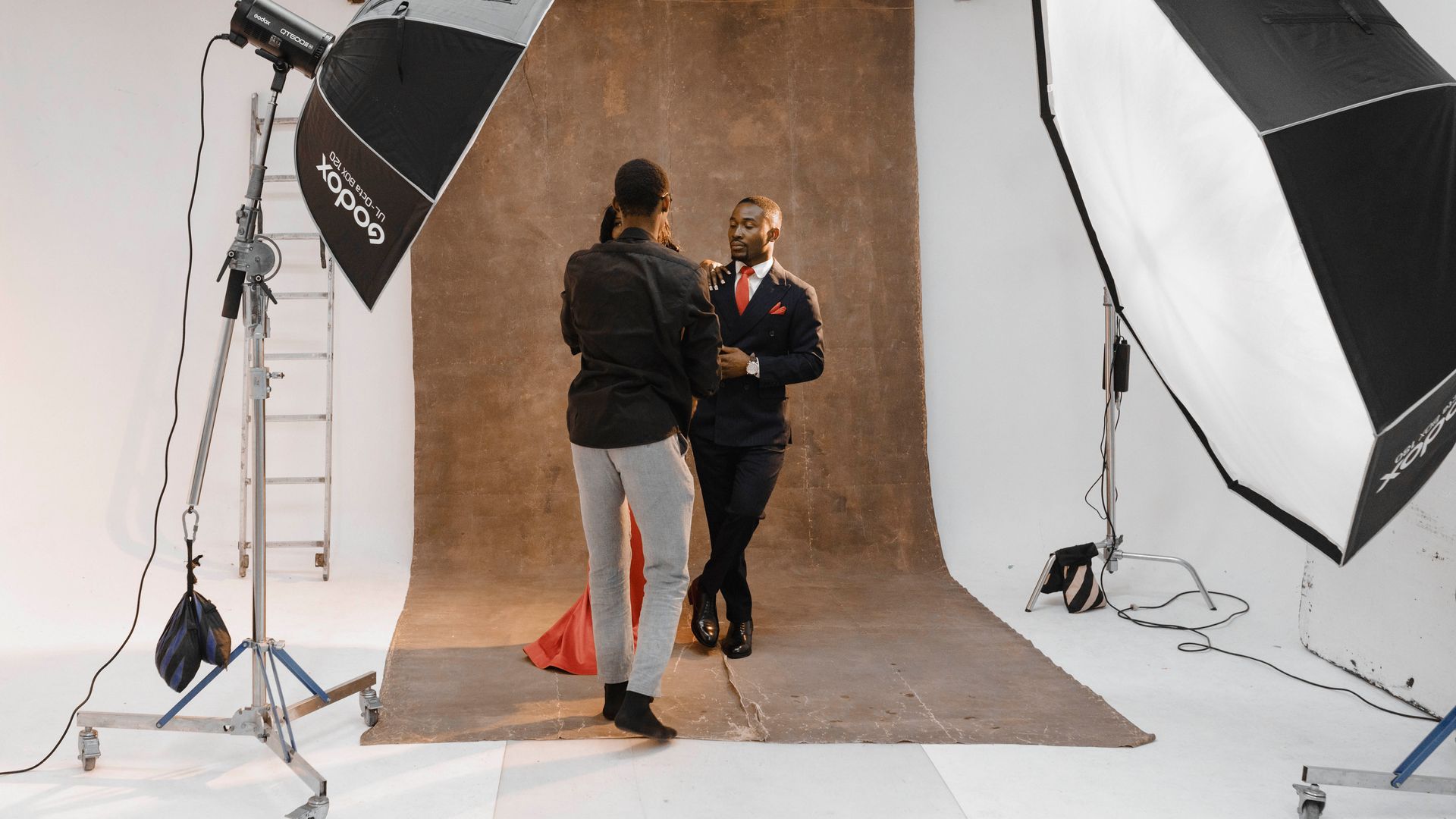 Microphones Near Me: Your Ultimate Audio Companion 7 A professional photoshoot session in a Ghanaian studio with lighting equipment and photographer setup — microphones near me