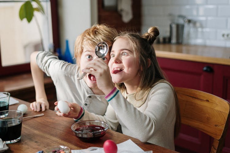 Kids Being Goofy While Making Easter Egg