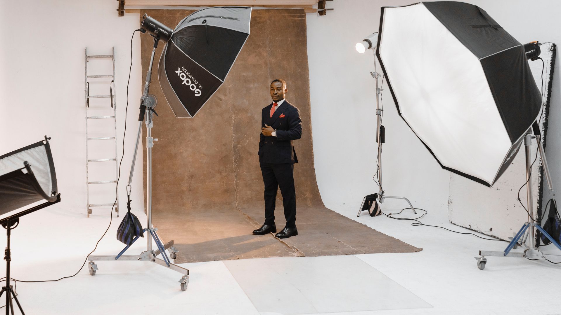 Microphones Near Me: Your Ultimate Audio Companion 3 Portrait shoot in a modern photo studio with lighting equipment and professional setup — microphones near me