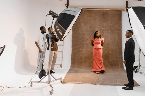 Free Behind-the-scenes view of a sophisticated studio portrait session. Stock Photo